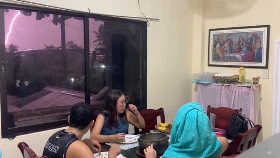 Family startled by thunderstorm during dinner in Iloilo City, Philippines