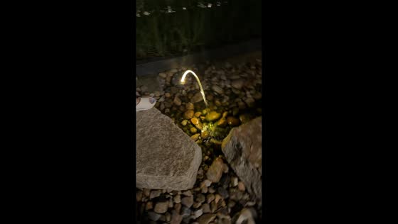 Water fountain creates glowing stream effect in Shanghai, China