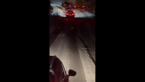 Truck stuck on icy narrow road creates long traffic buildup in Scotland, UK