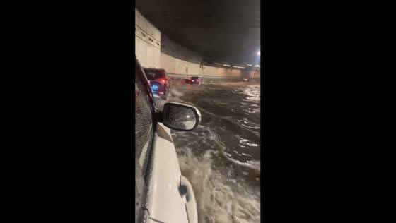 Cars nearly submerged in a flooded tunnel in Boston, USA