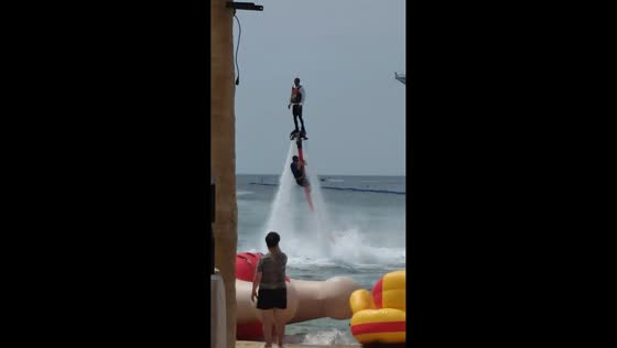 Flyboard performer amazes spectators with mid-air display in Liaoning, China