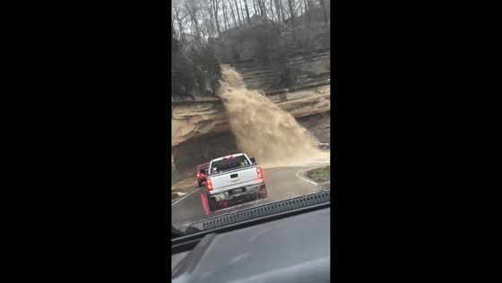 Water rushes down road after heavy rain in Madison, Indiana, USA