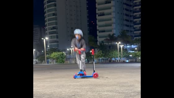 Boy falls attempting scooter jump trick in Guarujá, São Paulo, Brazil