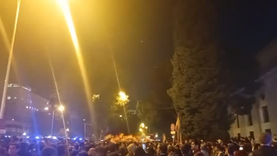 Protesters light red flares outside Spain’s Transport Ministry amid rail safety concerns in Madrid