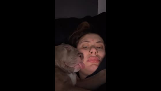 Doggo takes nap on owner's face: tongue out, no holds barred!