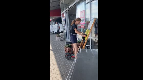 First-time rider's mishap: girl's scooter adventure ends with a bump!