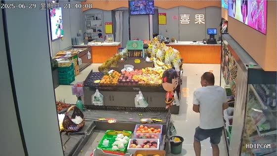 Man startled by cartoon character balloon while covering chiller in Henan, China