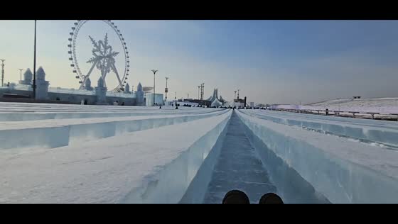 Sliding through snow slide at snow theme park in Heilongjiang, China