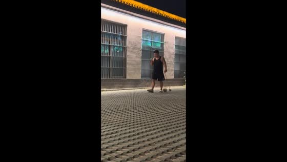 Man walks with empty leash as puppy chases in Shandong, China