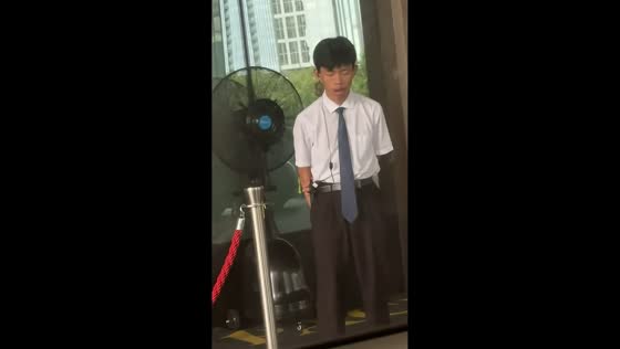 Sleepy security guard nearly loses balance while dozing on his feet in Zhejiang, China