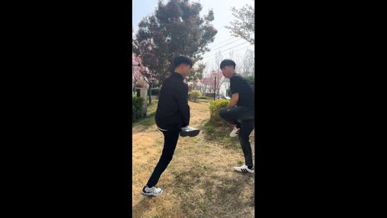 Boys lose balance during playful tackling game in Henan, China