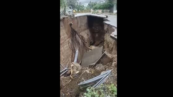 Flood waters destroy road in Acapulco, Mexico