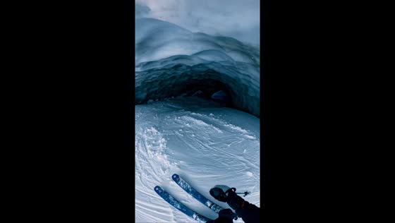 Extreme ski descent into glacier cave in Zermatt, Switzerland