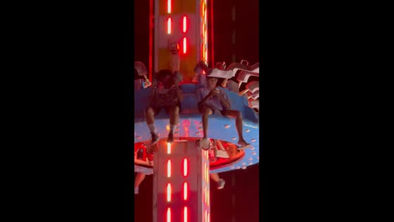 Man risks it all: using phone without seatbelt on scary fair ride