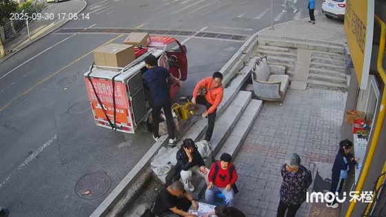 Bicycle crash startles pedestrians on a street in Shanxi, China