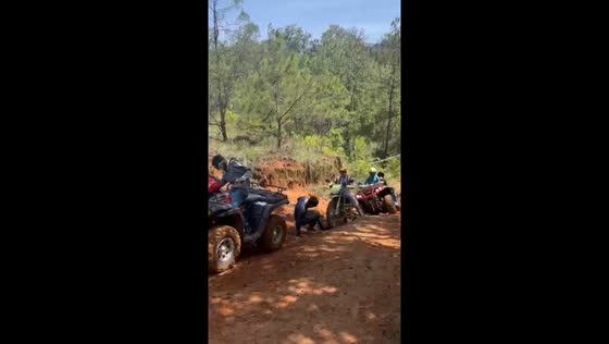 ATVs and bikes climb muddy hills in Villa Guerrero, Mexico