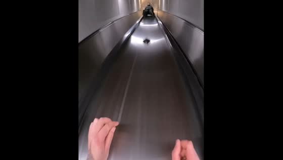 Person slides down multiple escalators in France