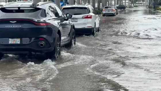 King Tides flood Las Olas Boulevard, submerging streets and parking areas in Florida, USA