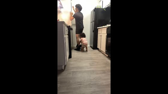 Little girl playfully pranks her dad in Phoenix, Arizona, USA