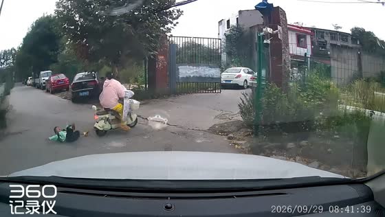 Child falls from electric scooter on bumpy road in Chen, China