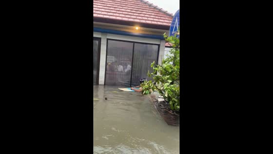 People evacuate flooded area in Kuta, Bali, Indonesia