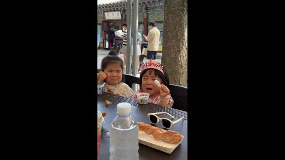 Children cry after bee flies near their food in Liaoning, China