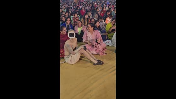 Man dressed as monkey surprises woman at cultural event in Bihar, India