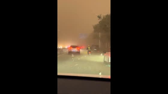Dust storm reduces visibility on city roads in Harbin, Heilongjiang, China