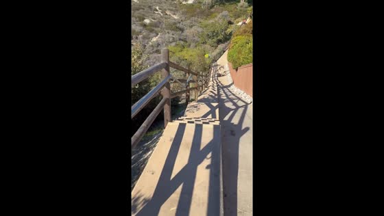 Skater collides head-on with biker in dramatic hill descent