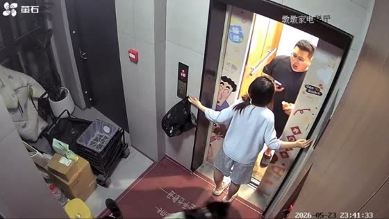 Man startled by woman waiting outside elevator in Shandong, China