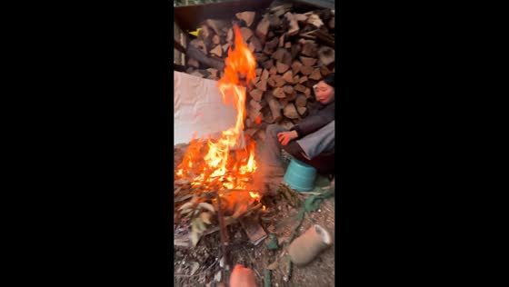 Bonfire mishap leaves woman burned and falling from chair in Sichuan, China