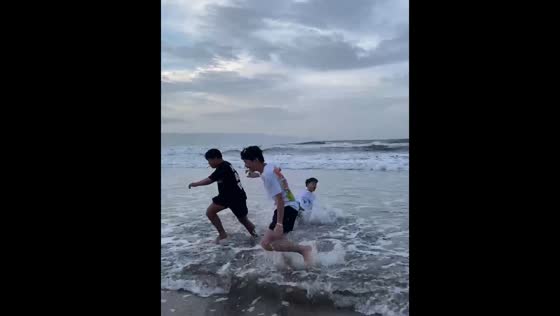 Boys prank friend by pushing him into ocean in Sukabumi City
