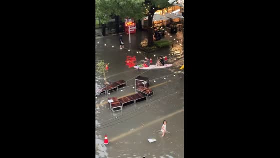 Floodwaters turn Shanghai streets into paddleboarding route, China