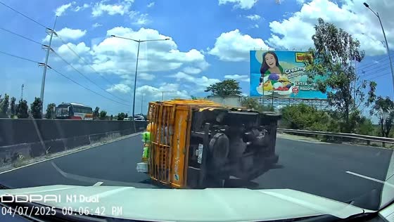 Softdrink truck overturns while overtaking on NLEX in Manila, Philippines