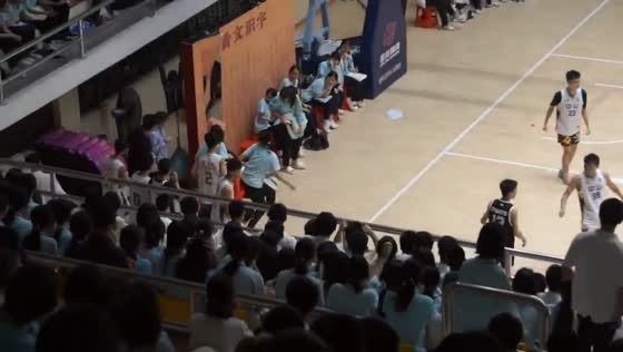 Basketball player crashes through light wall after going out of bounds in Guangdong, China