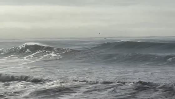 Powerful waves crash along the coast in Santa Cruz, California, USA