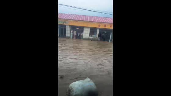 Severe flooding overwhelms streets and storefronts in Jilin, China