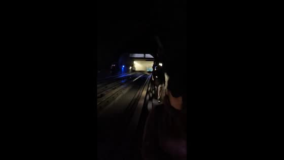 Metro passengers evacuate through tunnel after train fire in Santiago, Chile