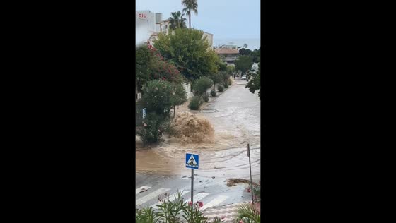 Flash flooding sends muddy water rushing through street in Torremolinos, Spain