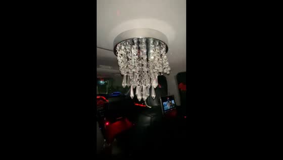 Chandelier seen hanging inside moving vehicle in Rhode Island, USA