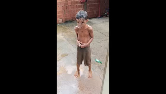 Kids return home covered in mud after playing outside in Taiaçu, Brazil