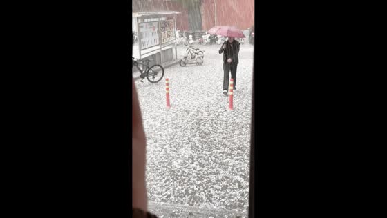 Heavy hailstorm leaves streets covered in ice in Datong, China