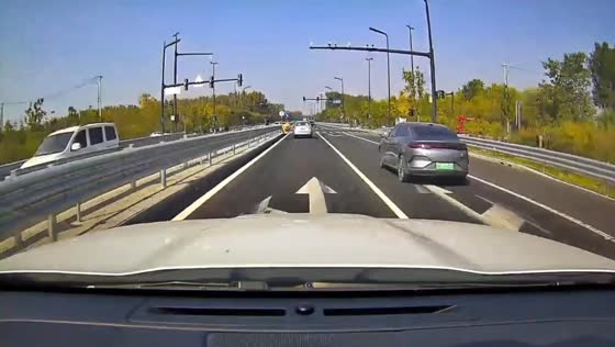 White sedan collides with another car at an intersection in Beijing, China