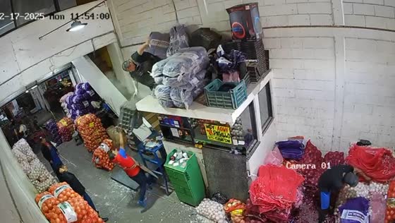 Worker falls after losing balance while handling crates in Mexico
