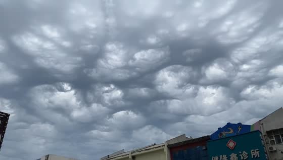 Unusual holes spotted in thick clouds in Liaoning, China