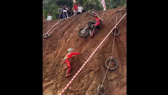 Biker falls on steep slope in Central Java and gets hit by tumbling bike