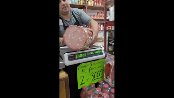 Baby reacts to giant mortadella being sliced in Buenos Aires, Argentina