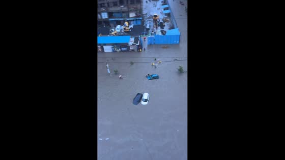 Severe flooding submerges vehicles in Vasai, Mumbai, India