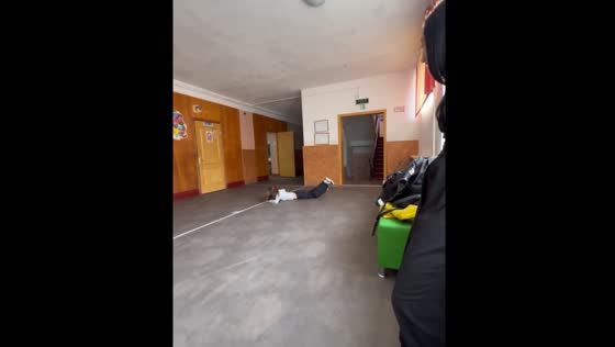 Girl spins until she loses balance and falls