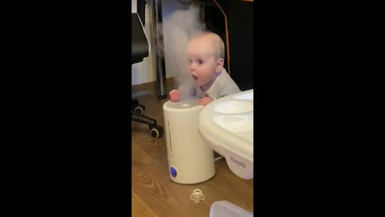 Child's curiosity: playing with the humidifier mist
